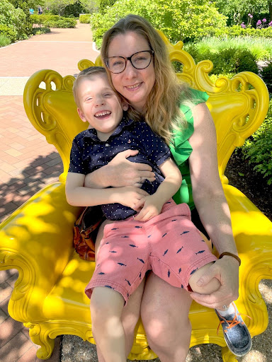 Wendy and Son sitting on a yellow chair